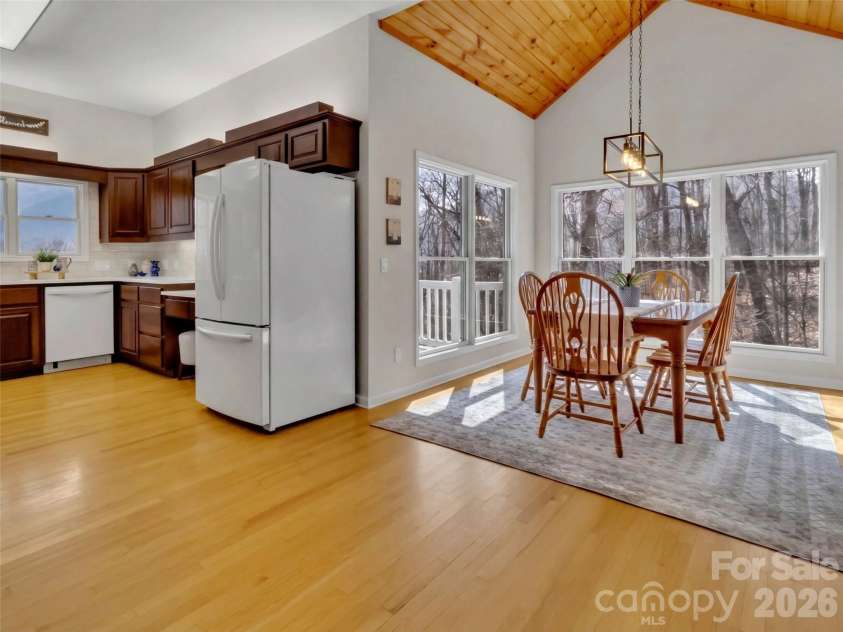 28 Mountain Breeze Drive, Maggie Valley, NC 28751.  MLS# CAR4271261, YatesRealty ID 3132. Kitchen Opens to Dining Area