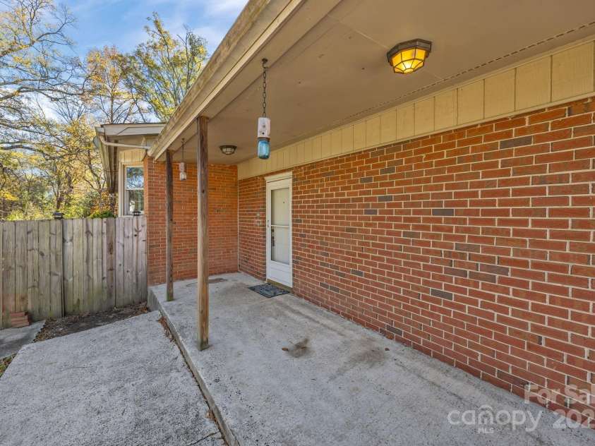 624 Patricia Avenue, Harrisburg, NC 28075.  MLS# CAR4321459, YatesRealty ID 3132. Back covered patio