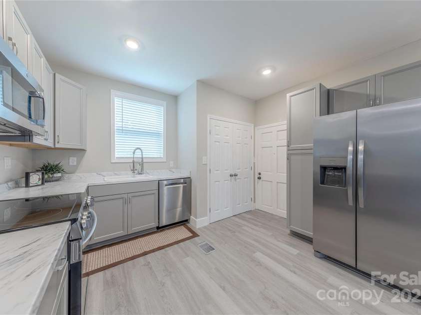 1334 Williams Estate Drive, Lancaster, SC 29720.  MLS# CAR4289609, YatesRealty ID 31322. Kitchen to laundry with washer and dryer included
