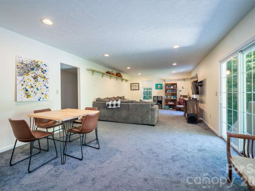 7 Firestone Court, Etowah, NC 28729.  MLS# CAR4383337, YatesRealty ID 31331. Basement living room