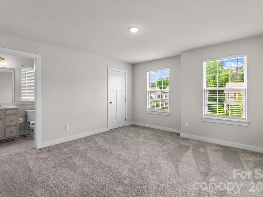 730 Autumn Sage Drive, Indian Trail, NC 28079.  MLS# CAR4390299, YatesRealty ID 31332. Upper Bedroom with private bathroom