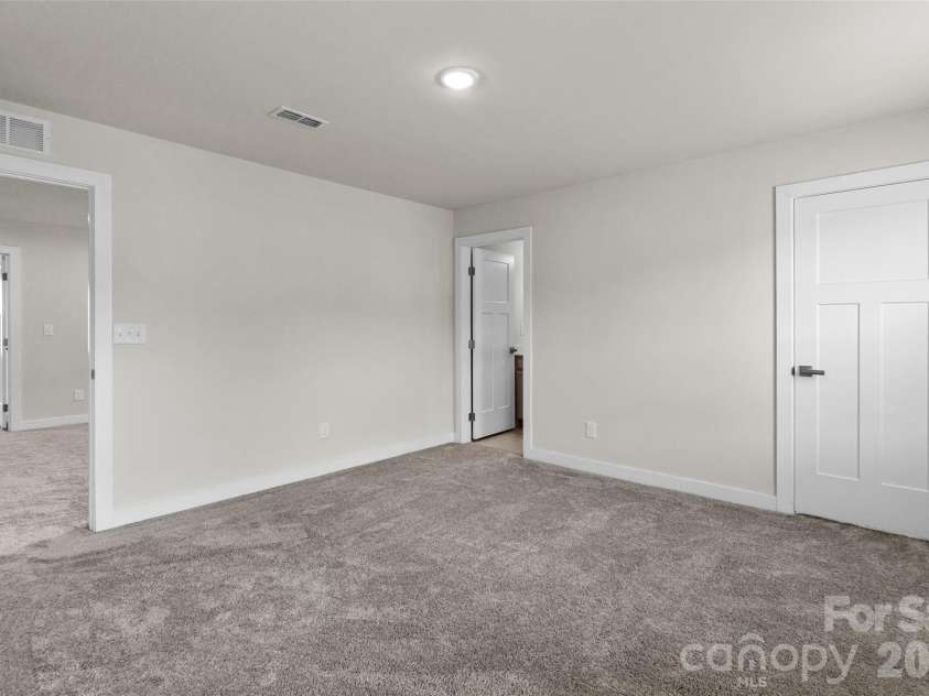 730 Autumn Sage Drive, Indian Trail, NC 28079.  MLS# CAR4390299, YatesRealty ID 31332. Upper Bedroom with private bathroom