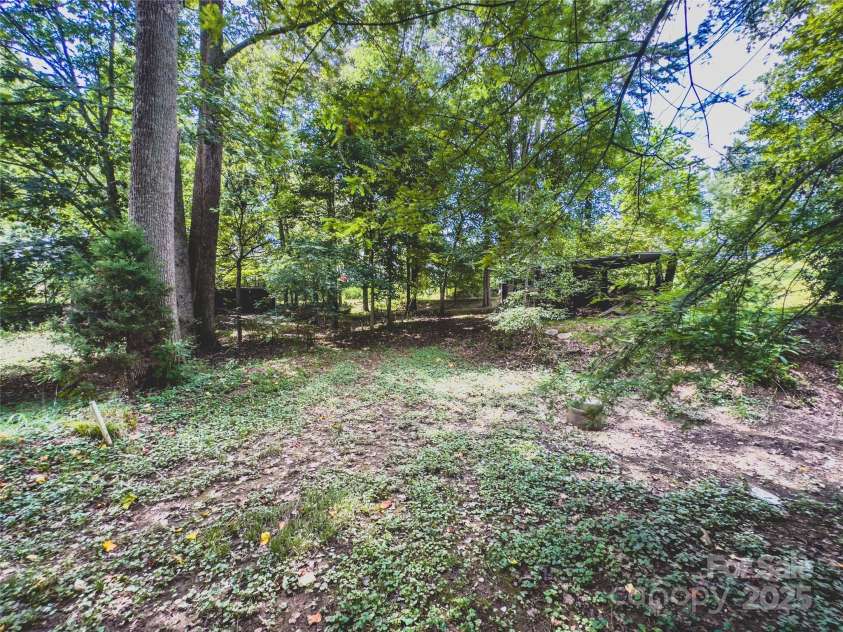 2680 Peachtree Road, Statesville, NC 28625.  MLS# CAR4290683, YatesRealty ID 31333. 1.75 acres with plenty of room to garden, play or expand.