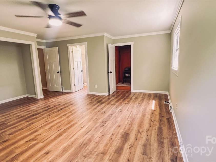 2680 Peachtree Road, Statesville, NC 28625.  MLS# CAR4290683, YatesRealty ID 31333. Spacious primary bedroom with fresh flooring and paint - move-in ready comfort.