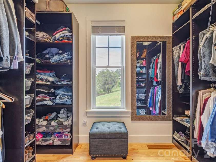 18 Adas Way, Weaverville, NC 28787.  MLS# CAR4385497, YatesRealty ID 31334. A huge walk-in closet with built-ins in the primary suite 