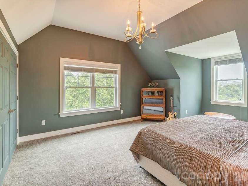18 Adas Way, Weaverville, NC 28787.  MLS# CAR4385497, YatesRealty ID 31334. A linen closet and lighted, climate-controlled storage on both sides of the bedroom closets upstairs ensure there is a place for everything