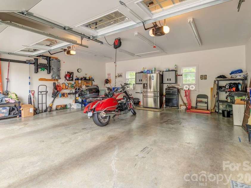 18 Adas Way, Weaverville, NC 28787.  MLS# CAR4385497, YatesRealty ID 31334. A truly oversized, extra deep garage with 250sqft pull down attic access storage 