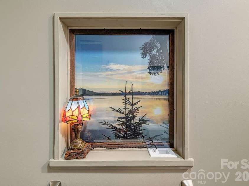 18 Adas Way, Weaverville, NC 28787.  MLS# CAR4385497, YatesRealty ID 31334. Artistic touches throughout the home, including a beautiful picture window in the lower level bathroom 