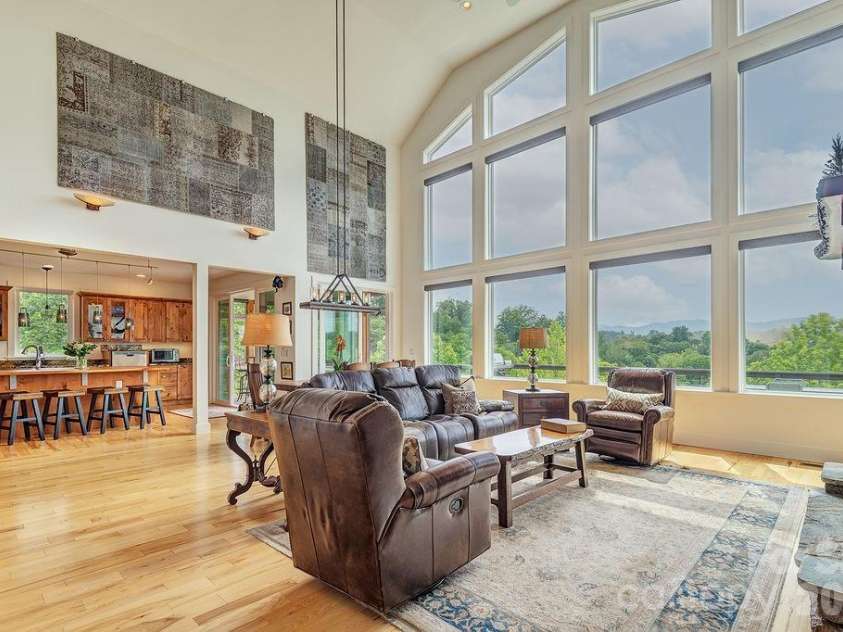 18 Adas Way, Weaverville, NC 28787.  MLS# CAR4385497, YatesRealty ID 31334. Custom Hunter Douglas power blinds in the living room allow you to bathe the space in light or create a cozy retreat with the touch of a button