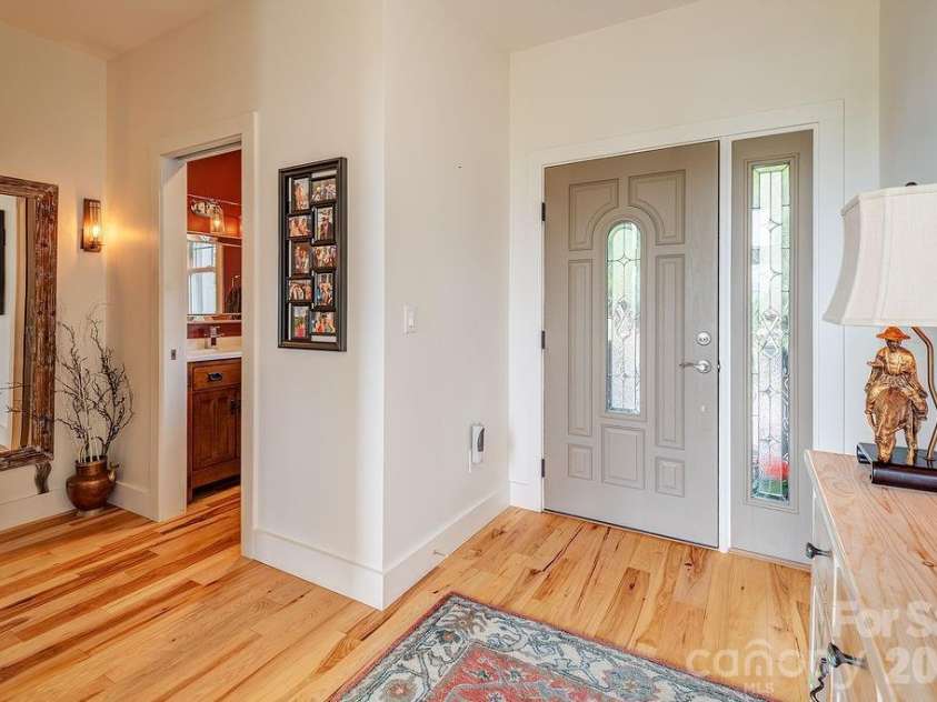 18 Adas Way, Weaverville, NC 28787.  MLS# CAR4385497, YatesRealty ID 31334. Hubbardton Forge lighting fixtures cast a beautiful glow throughout the hallways and living spaces, with dimmers on every light for effortless ambiance