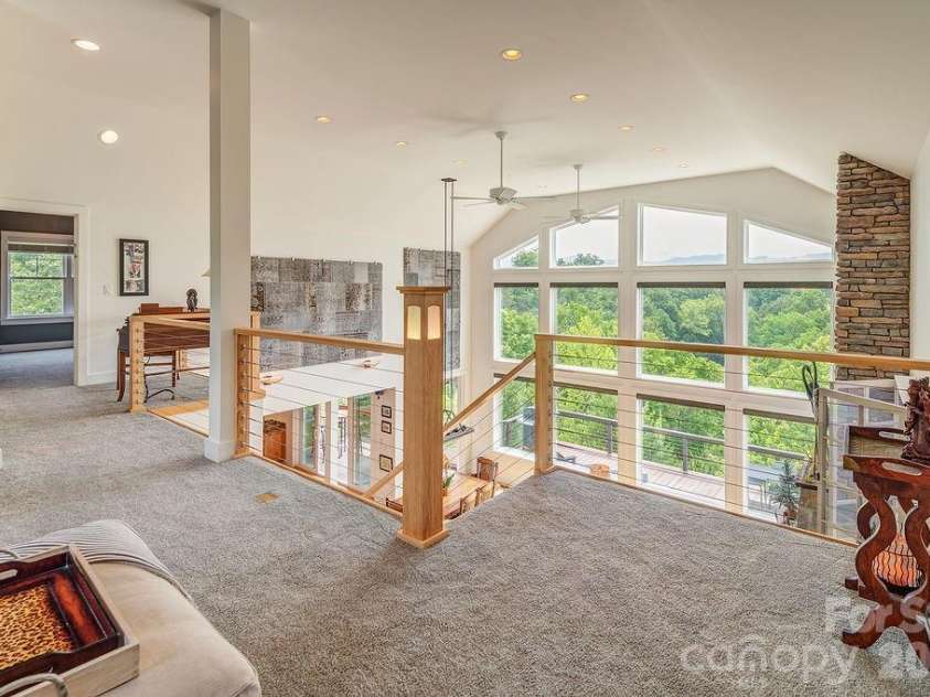 18 Adas Way, Weaverville, NC 28787.  MLS# CAR4385497, YatesRealty ID 31334. Stair lighting ascends gracefully to a post light at the top of the stairs, adding elegance and warmth