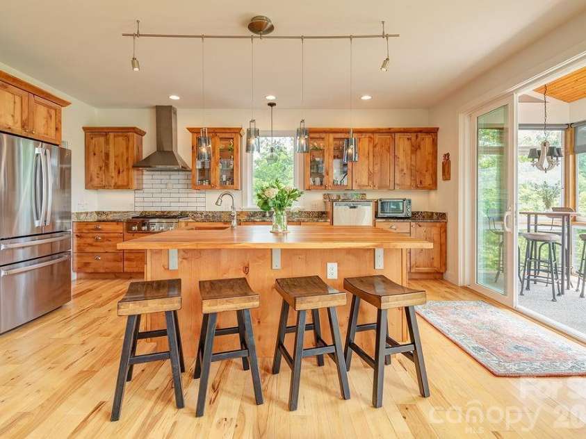 18 Adas Way, Weaverville, NC 28787.  MLS# CAR4385497, YatesRealty ID 31334. The breakfast bar is where the day begins where you can pull up a stool, pour something warm, and let the morning light and mountain views remind you that there is nowhere else you need to be! 