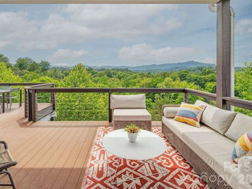 18 Adas Way, Weaverville, NC 28787.  MLS# CAR4385497, YatesRealty ID 31334. The decks were designed for living, dining, relaxing, and for watching the mountains change color with the seasons