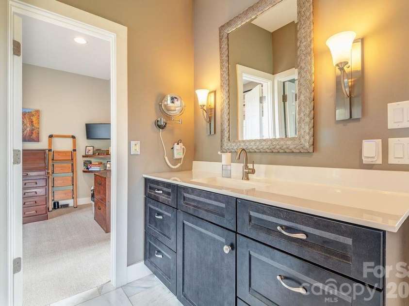 18 Adas Way, Weaverville, NC 28787.  MLS# CAR4385497, YatesRealty ID 31334. The en suite bathroom connects the primary bedroom and the study 