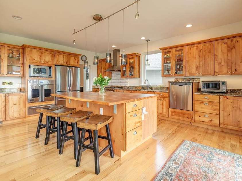 18 Adas Way, Weaverville, NC 28787.  MLS# CAR4385497, YatesRealty ID 31334. The kitchen is appointed with a Thermador gas range, Viking microwave, oven and warming drawer, GE Profile refrigerator, and Zephyr exhaust fan