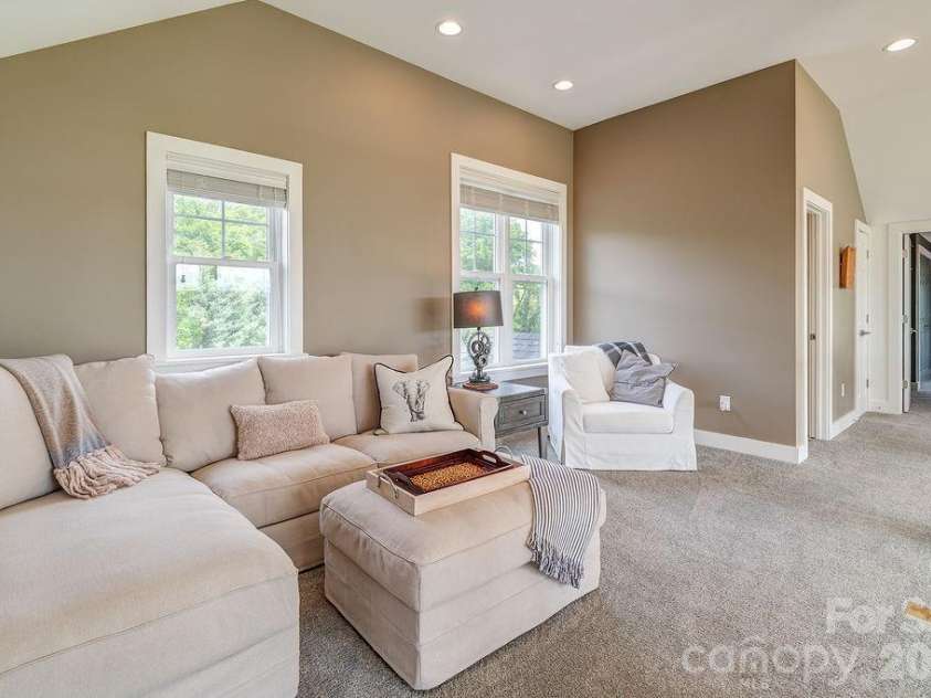 18 Adas Way, Weaverville, NC 28787.  MLS# CAR4385497, YatesRealty ID 31334. The oversized loft area, open to living room below, gives an additional space to relax and unwind, all with more mountain views 