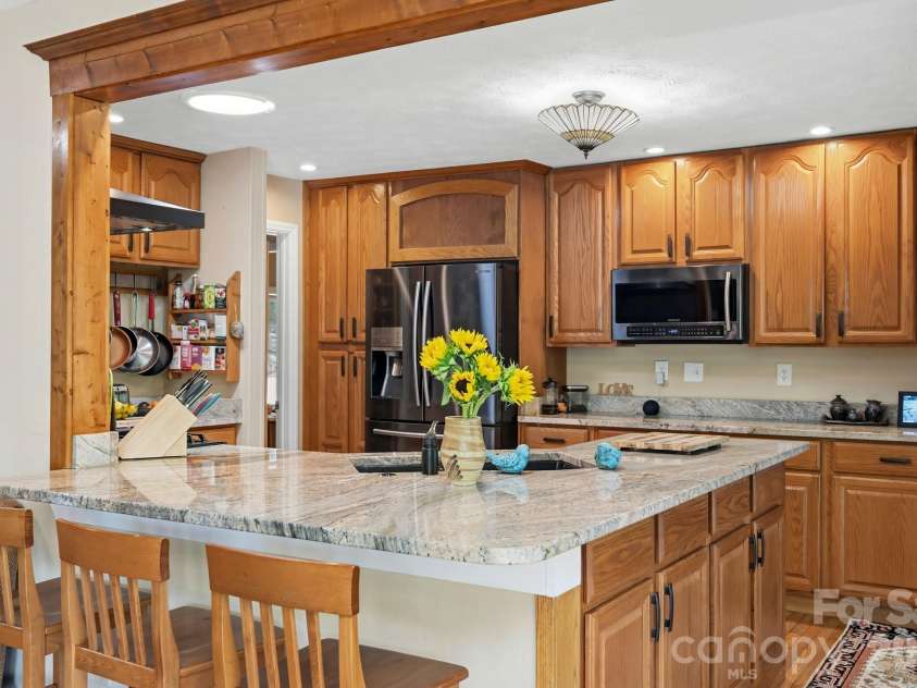 11 Echo Lake Drive, Fairview, NC 28730.  MLS# CAR4387481, YatesRealty ID 31338. Kitchen with Wrap-Around Counter and Breakfast Bar