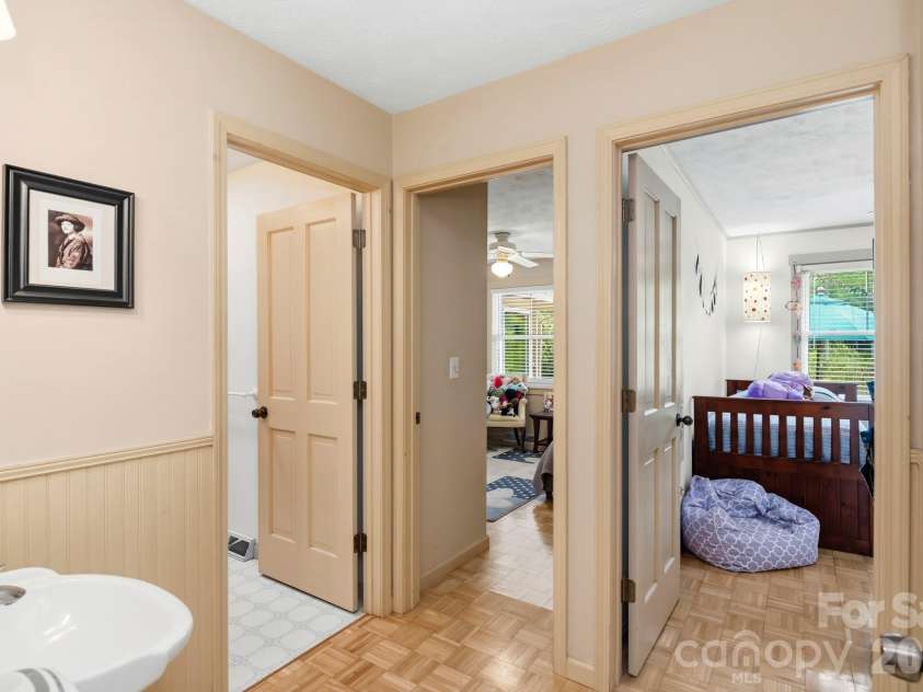 11 Echo Lake Drive, Fairview, NC 28730.  MLS# CAR4387481, YatesRealty ID 31338. Main-Level 'Wing' Is Private and Features Two Bedrooms