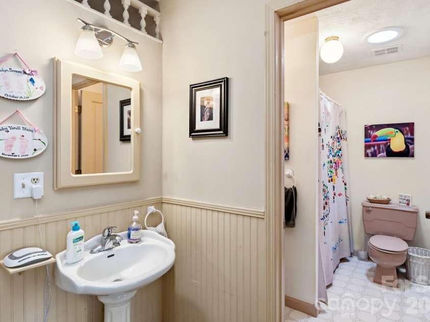 11 Echo Lake Drive, Fairview, NC 28730.  MLS# CAR4387481, YatesRealty ID 31338. Shared Sink and Private Shower
