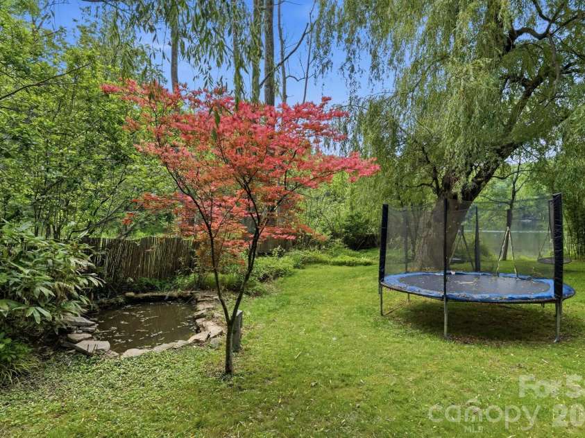 11 Echo Lake Drive, Fairview, NC 28730.  MLS# CAR4387481, YatesRealty ID 31338. Stacked Stone-surround Pond