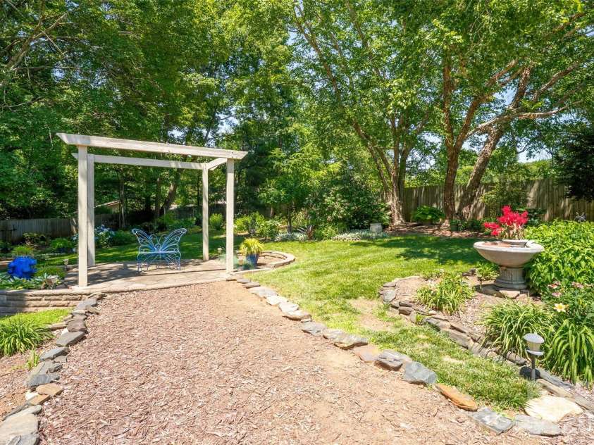 7029 Forest Hills Drive, Denver, NC 28037.  MLS# CAR4386920, YatesRealty ID 31346. Backyard Fire pit area and pergola
