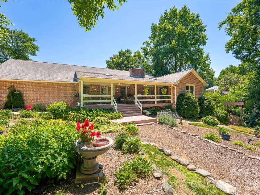 7029 Forest Hills Drive, Denver, NC 28037.  MLS# CAR4386920, YatesRealty ID 31346. Backyard looking at house