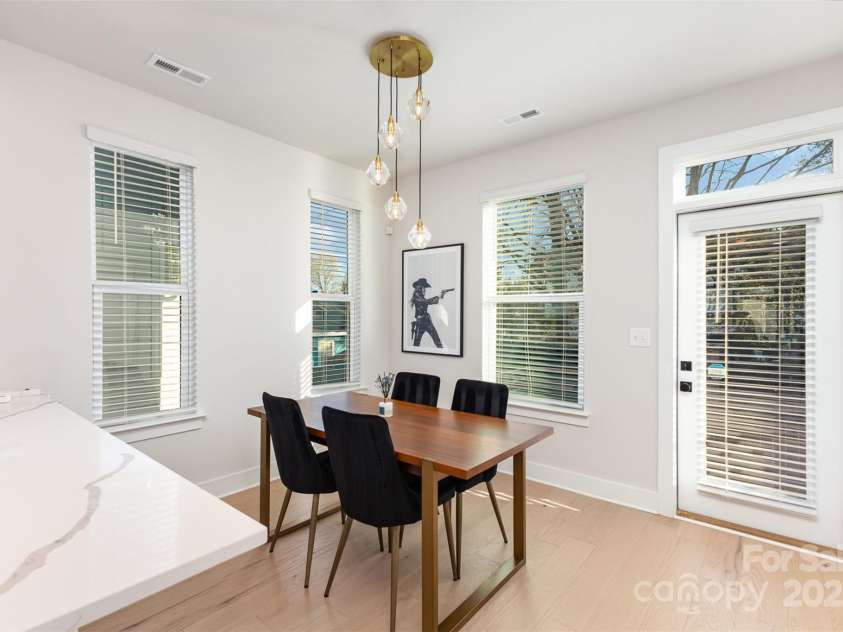 5048 York Park Lane, Charlotte, NC 28217.  MLS# CAR4216095, YatesRealty ID 3135. Dining area with balcony behind