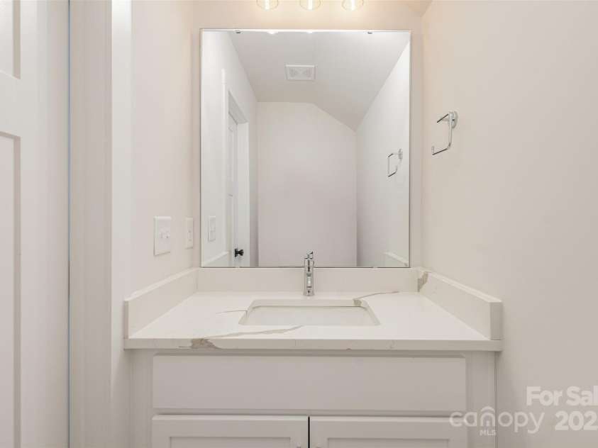 5048 York Park Lane, Charlotte, NC 28217.  MLS# CAR4216095, YatesRealty ID 3135. Half bathroom on the top floor