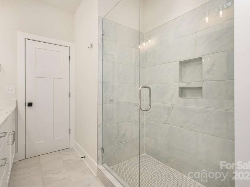 5048 York Park Lane, Charlotte, NC 28217.  MLS# CAR4216095, YatesRealty ID 3135. Primary bathroom shower