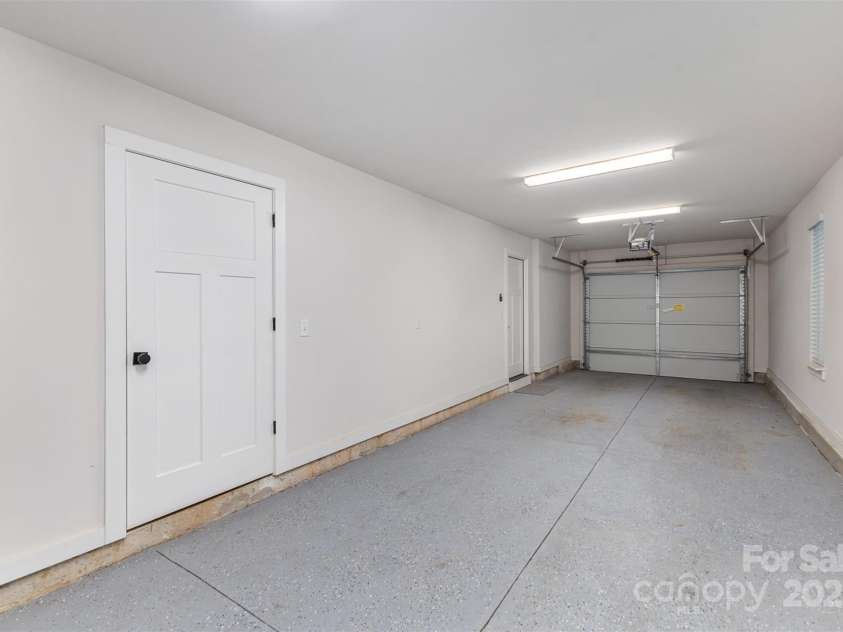 5048 York Park Lane, Charlotte, NC 28217.  MLS# CAR4216095, YatesRealty ID 3135. Tandem garage with storage closet