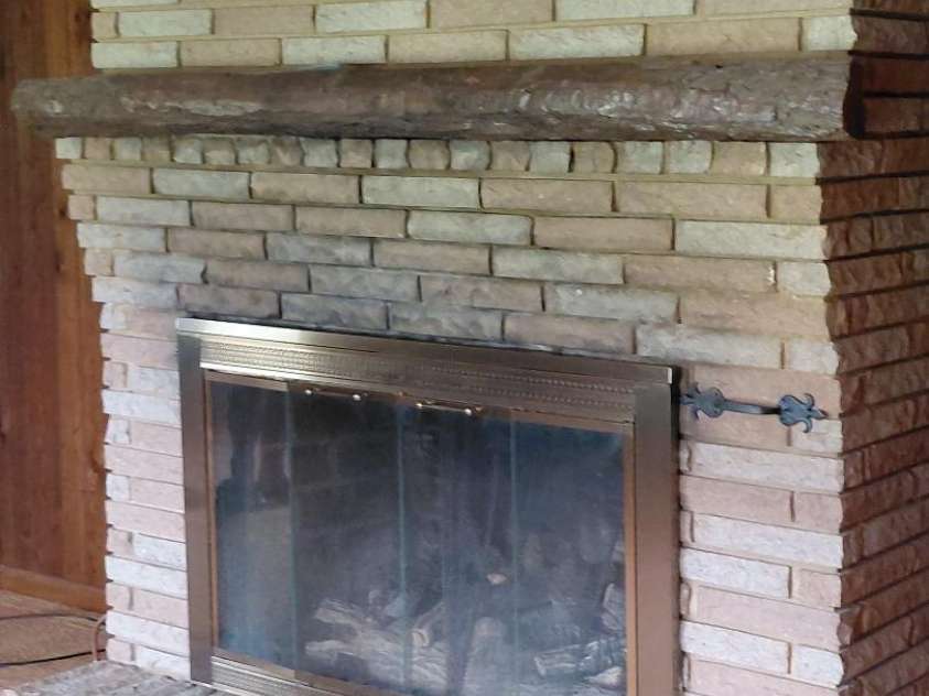 3844 Dover Street, Claremont, NC 28610.  MLS# CAR4290927, YatesRealty ID 31350. Brick fireplace with gas logs