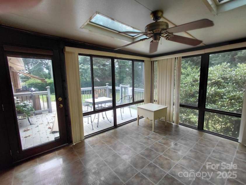 3844 Dover Street, Claremont, NC 28610.  MLS# CAR4290927, YatesRealty ID 31350. Sunroom with skylights