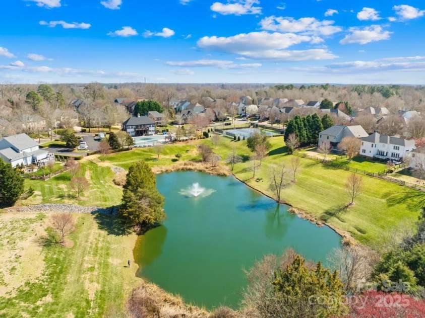 9433 Gilpatrick Lane, Huntersville, NC 28078.  MLS# CAR4231980, YatesRealty ID 3137. Community pond and amenities in the back ground