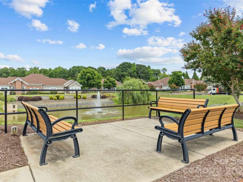 3270 Abbey Walk Lane, Matthews, NC 28105.  MLS# CAR4288401, YatesRealty ID 31371. Bench seating for gathering