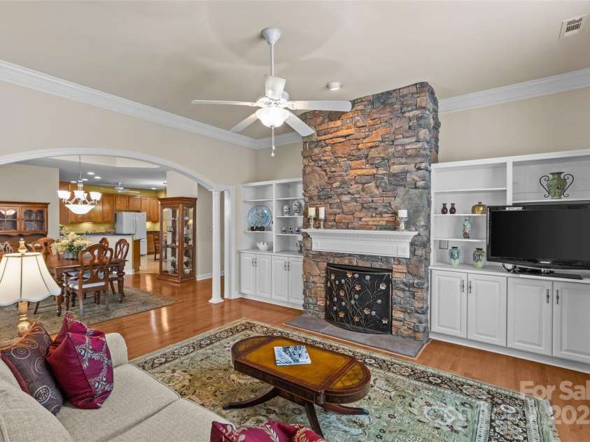3270 Abbey Walk Lane, Matthews, NC 28105.  MLS# CAR4288401, YatesRealty ID 31371. Built-ins surround the fireplace