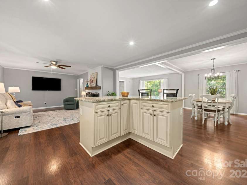 725 Plantation Road, Lancaster, SC 29720.  MLS# CAR4278897, YatesRealty ID 31372. Open floor plan, view to family room and dining area from kitchen.