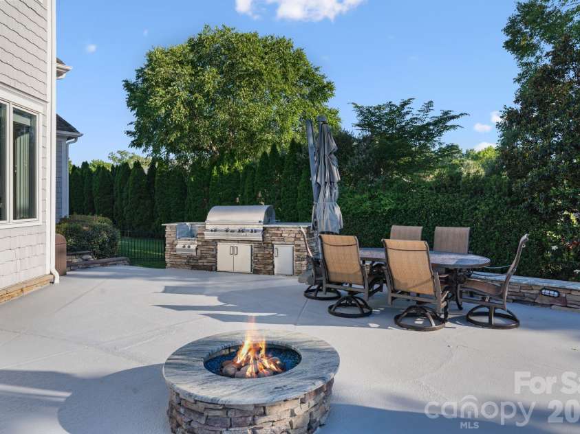 2477 Peninsula Shores Court, Denver, NC 28037.  MLS# CAR4390054, YatesRealty ID 31373. Pool firepit & grill