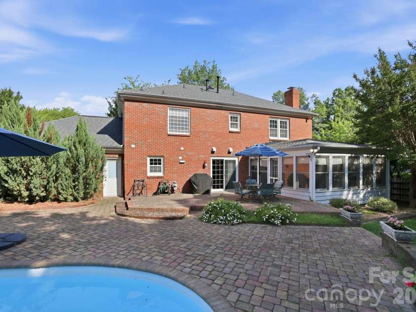 4612 Deanscroft Drive, Charlotte, NC 28226.  MLS# CAR4389186, YatesRealty ID 31374. Sunroom and additional area for outside patio set.