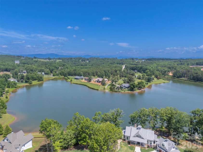 398 Mapleton Lane, Columbus, NC 28722.  MLS# CAR4393897, YatesRealty ID 31376. 33-acre spring fed lake for peaceful living 