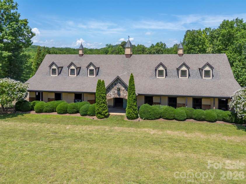 398 Mapleton Lane, Columbus, NC 28722.  MLS# CAR4393897, YatesRealty ID 31376. Community barn with wash-stall, tack room, bathroom, laundry