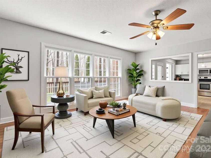 8802 Glenside Street, Huntersville, NC 28078.  MLS# CAR4316716, YatesRealty ID 31376. Living room is open to kitchen (virtually staged).