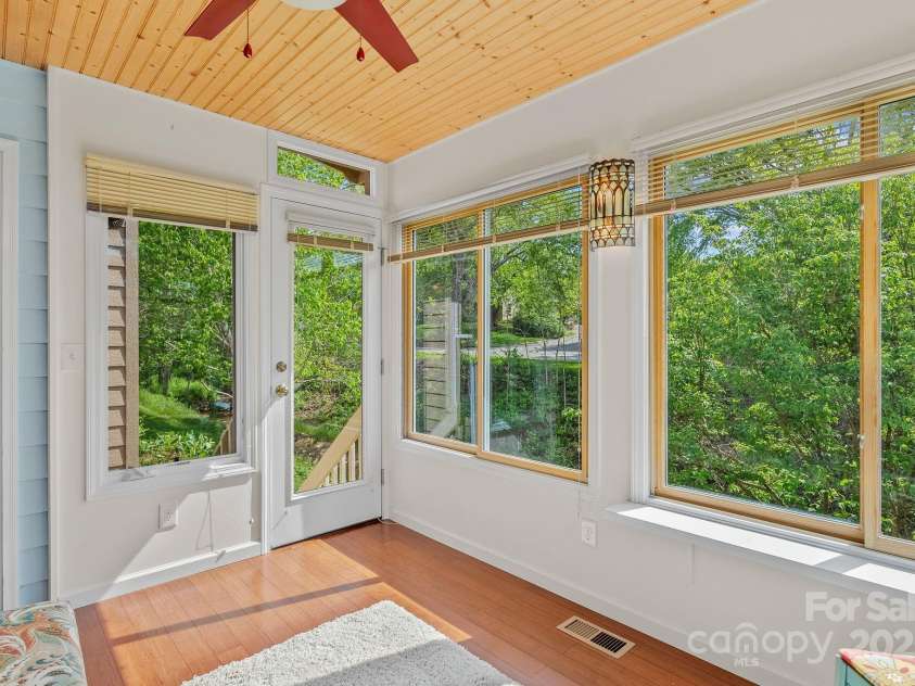 4-B HedgeRose Court, Asheville, NC 28805.  MLS# CAR4258653, YatesRealty ID 31392. Doors lead out to sit by the creek...