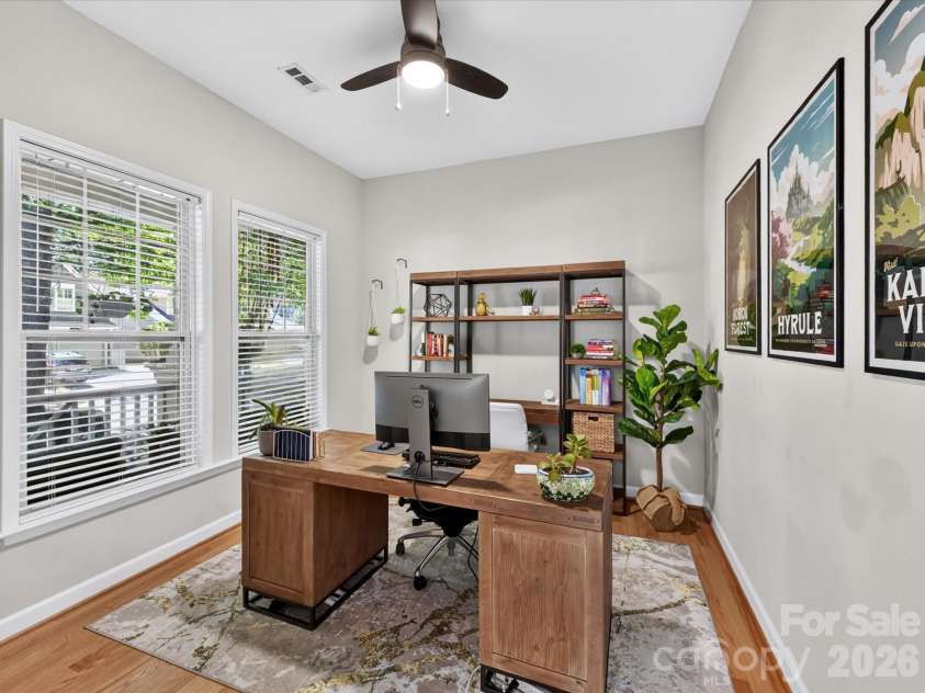17404 Harbor Walk Drive, Cornelius, NC 28031.  MLS# CAR4393057, YatesRealty ID 31396. This versatile home office offers a bright and productive workspace with hardwood floors, large windows, and ample room for remote work, study, or creative pursuits.