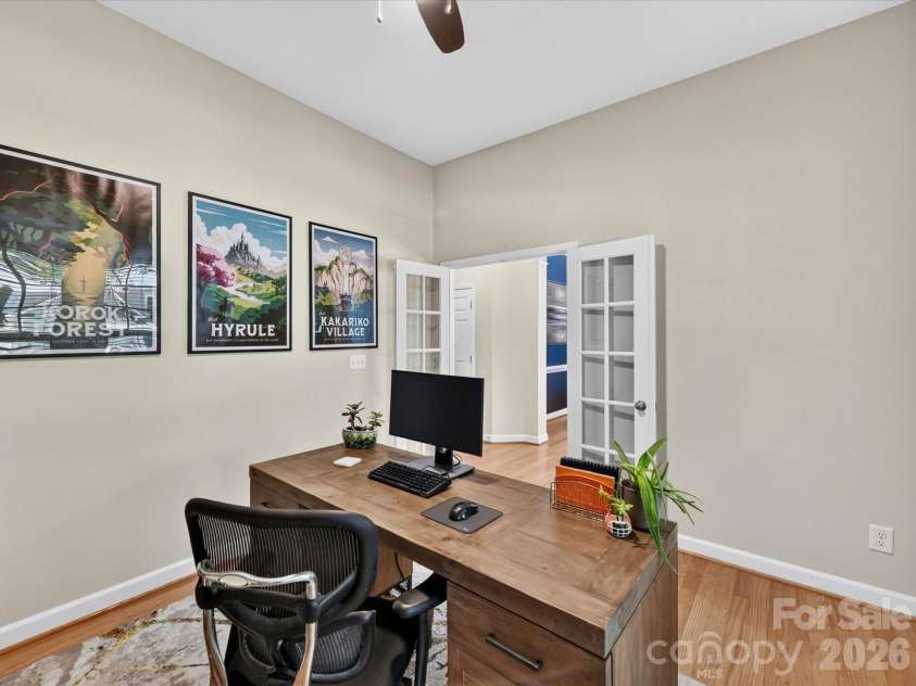 17404 Harbor Walk Drive, Cornelius, NC 28031.  MLS# CAR4393057, YatesRealty ID 31396. This versatile home office offers a bright and productive workspace with hardwood floors, large windows, and ample room for remote work, study, or creative pursuits.