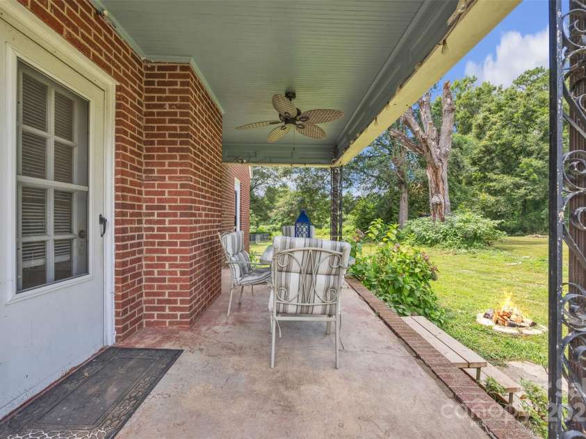103 7th Street, Taylorsville, NC 28681.  MLS# CAR4285749, YatesRealty ID 31398. Enjoy evenings on the side porch by the fire pit