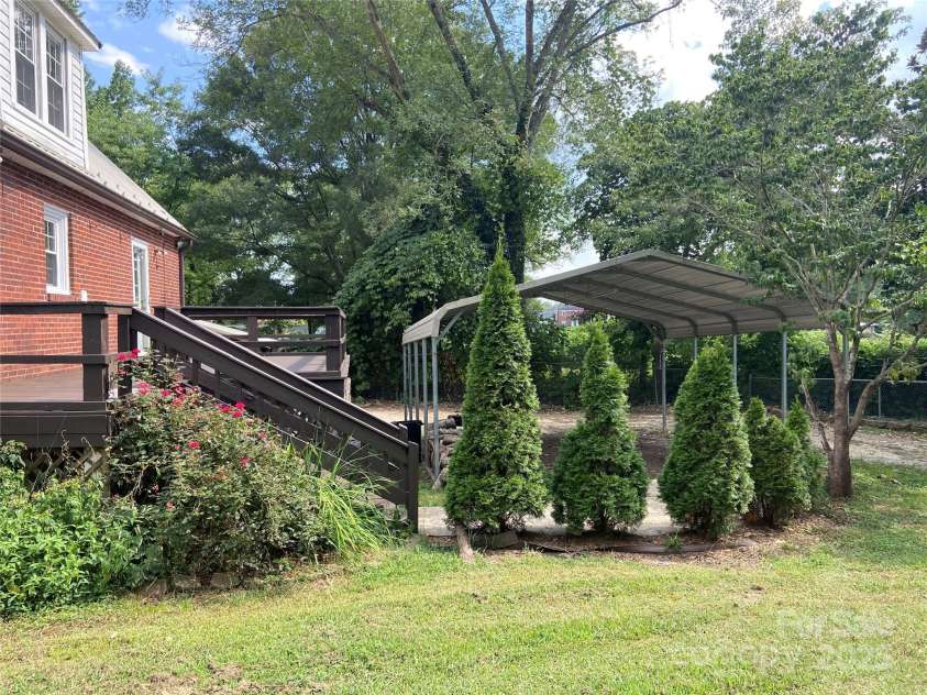 103 7th Street, Taylorsville, NC 28681.  MLS# CAR4285749, YatesRealty ID 31398. Side Yard / Back Deck / Carport