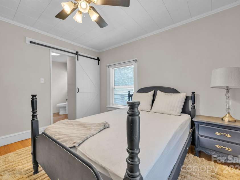 103 7th Street, Taylorsville, NC 28681.  MLS# CAR4285749, YatesRealty ID 31398. Slide the Barn Door to access the EnSuite