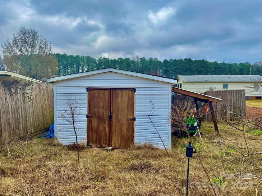 2034 Whitegate Lane, Newton, NC 28658.  MLS# CAR4205762, YatesRealty ID 314. Backyard Shed
