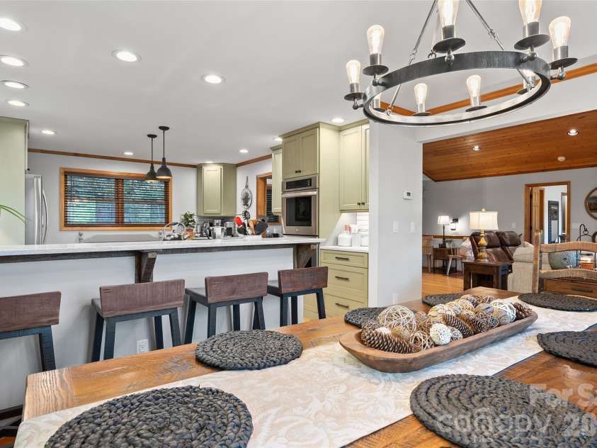 359 Saddlebrook Lane, Clyde, NC 28721.  MLS# CAR4393520, YatesRealty ID 31400. Dining area into kitchent