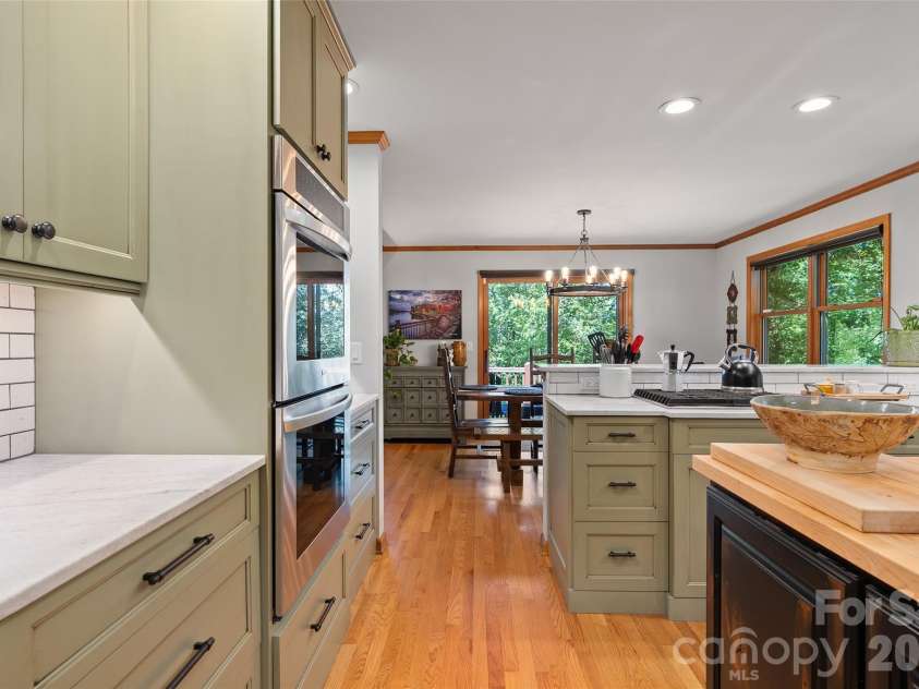 359 Saddlebrook Lane, Clyde, NC 28721.  MLS# CAR4393520, YatesRealty ID 31400. Kitchen to dining area